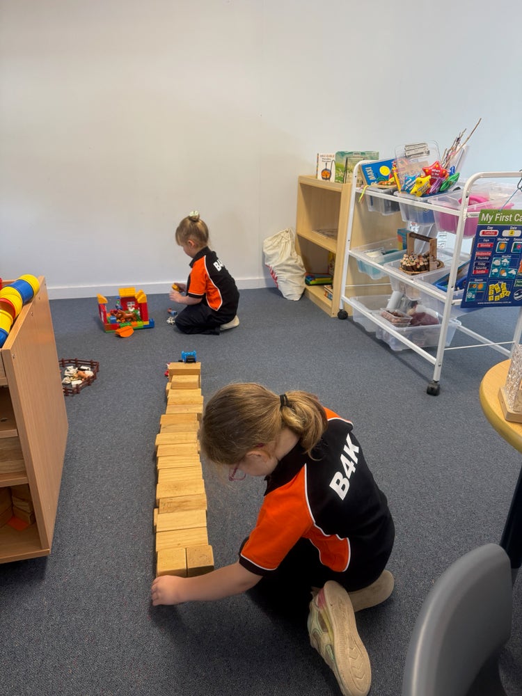 Photo shows two B4K students constructing with bricks during free paly..